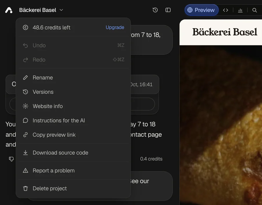 The project menu under the website's name: credits left with Upgrade, Undo, Redo, Rename, Versions, Website info, Instructions for the AI, Copy preview link, Download source code, Report a problem and Delete project